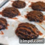 Salted Caramel Dark Chocolate Cookies on a cooling rack