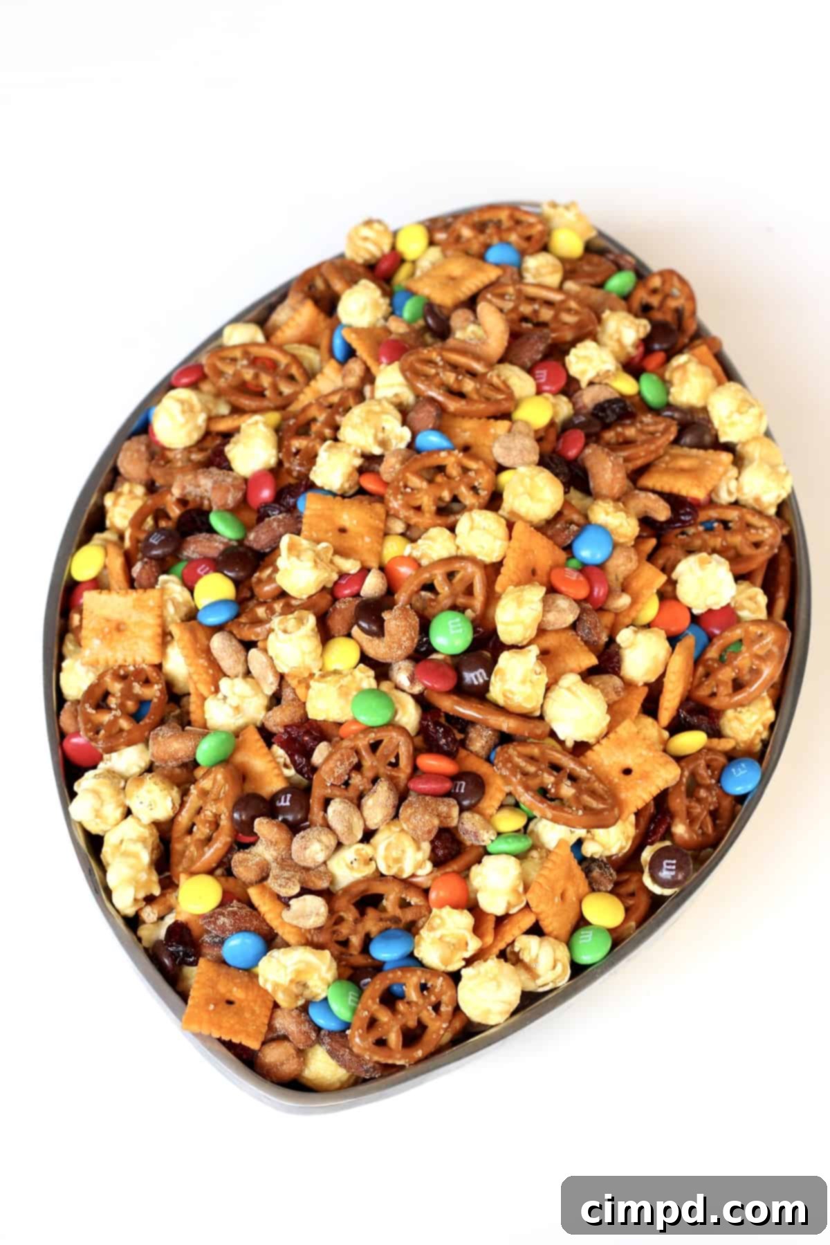 Touchdown Snack Mix - A bowl filled with sweet and salty football-themed snacks.