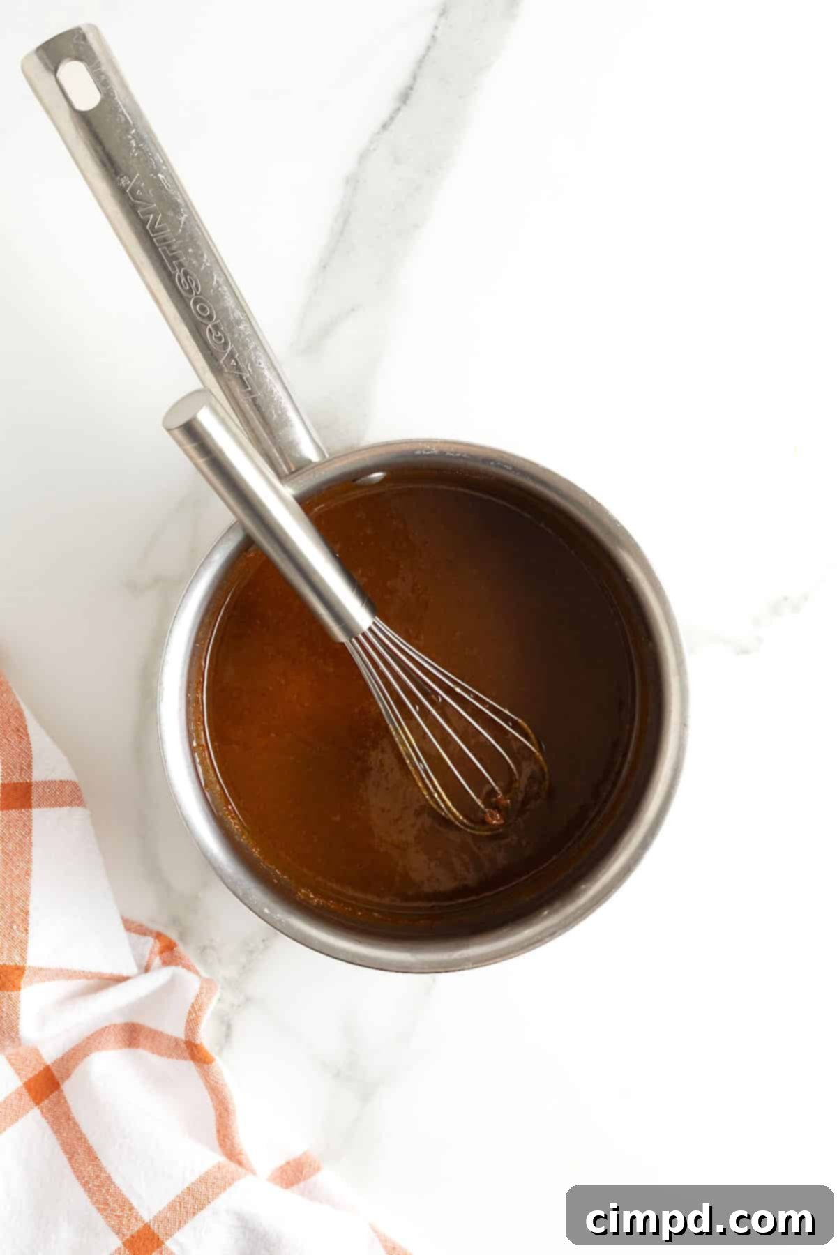 Autumn Pumpkin Banana Pancakes with Pumpkin Spice Drizzle 12 A saucepan of pumpkin spice syrup.