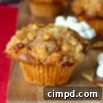 Close-up of a S'mores Streusel Muffin with golden topping