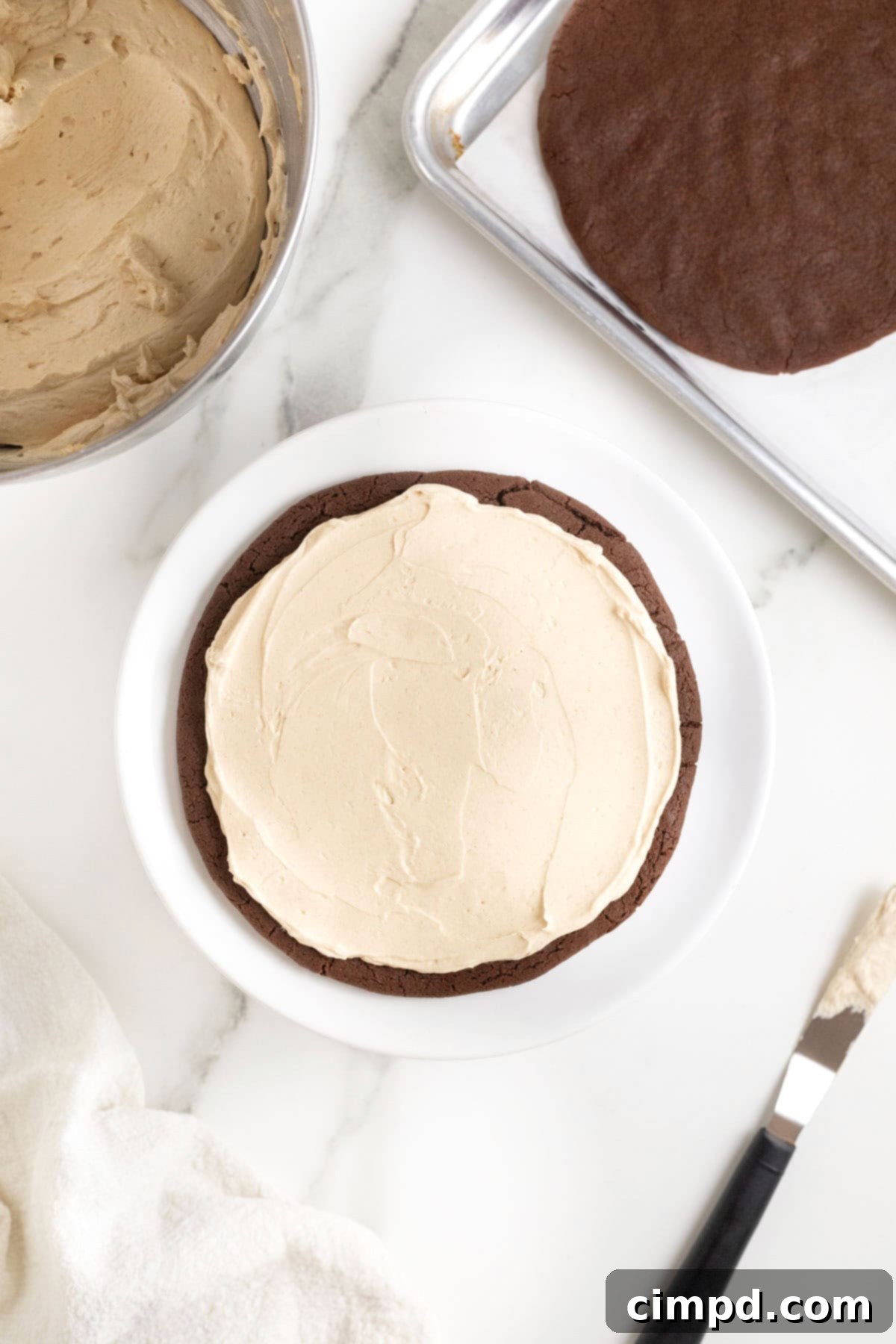 Decadent Peanut Butter Chocolate Cookie Tower 11 Close-up of a chocolate cookie layer with a generous spread of creamy peanut butter filling.