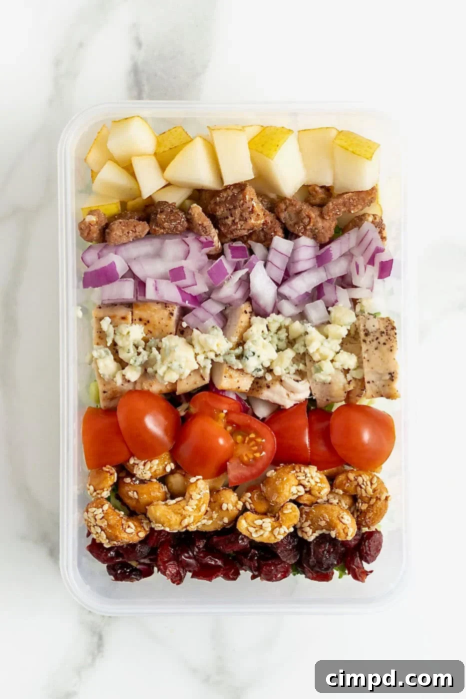 Quick 5-Minute Lunch Salad 8 Apples, onions, gorgonzola crumbles, cherry tomato halves, candied cashews and dried cranberries in an airtight plastic container.