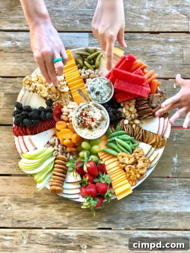 Close-up of a diverse Trader Joe's charcuterie board featuring cheeses, crackers, fruits, and nuts