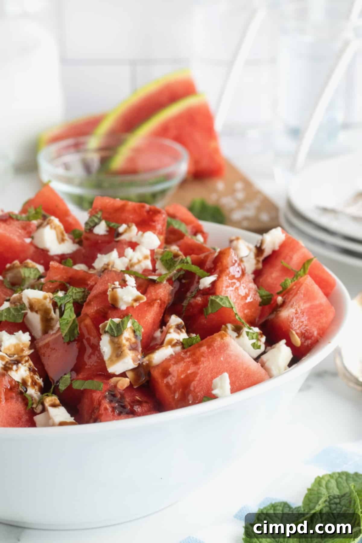 Watermelon Feta Salad by The BakerMama - A refreshing summer side dish with mint and balsamic glaze.