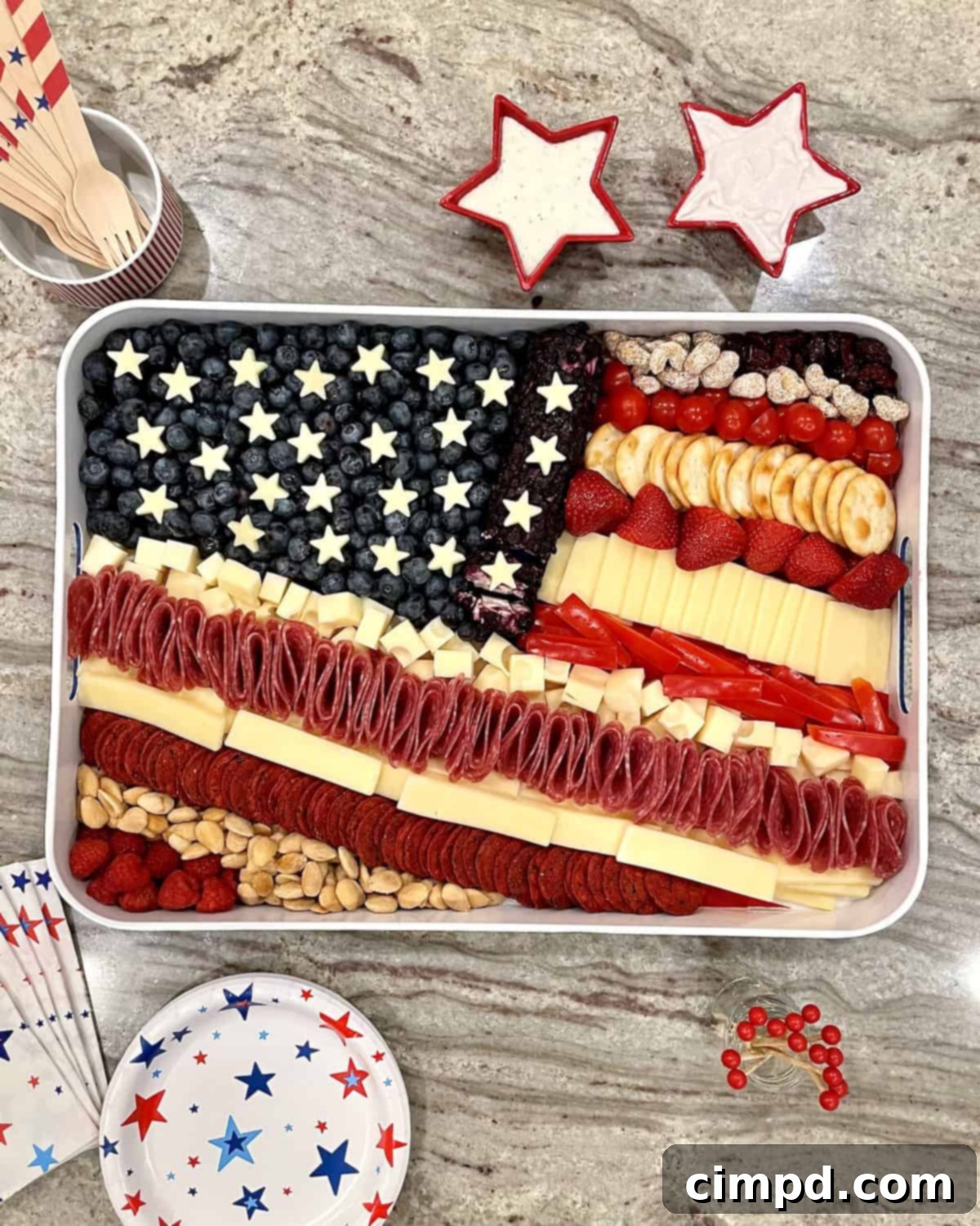 Stars & Stripes Cheese Platter 2 Vibrant American Flag Cheese Tray featuring red berries, white cheeses, and blueberries, a patriotic and tasty snack board perfect for Fourth of July festivities.