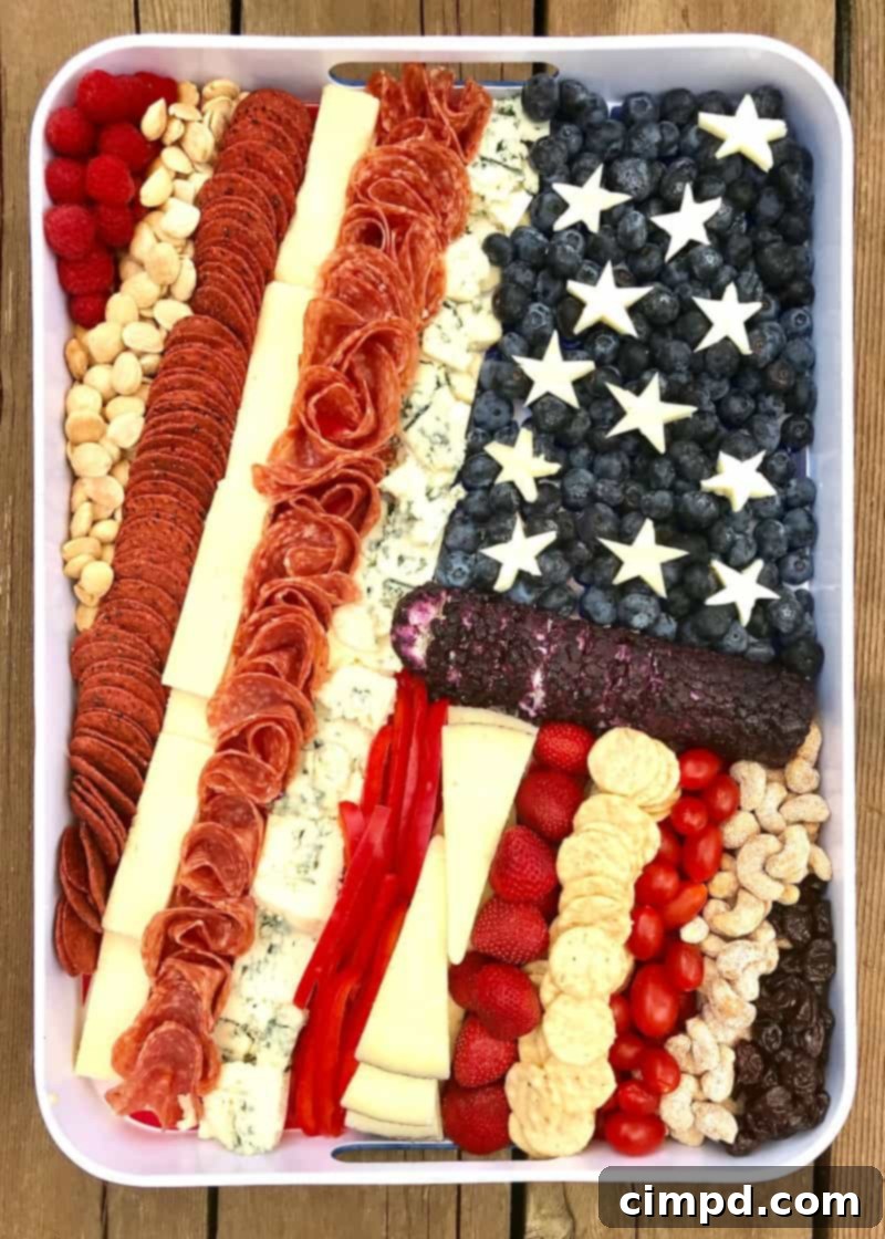 Stars & Stripes Cheese Platter 5 Another perspective of the American Flag Cheese Tray by The BakerMama, highlighting the elegant arrangement and variety of delicious patriotic snacks.