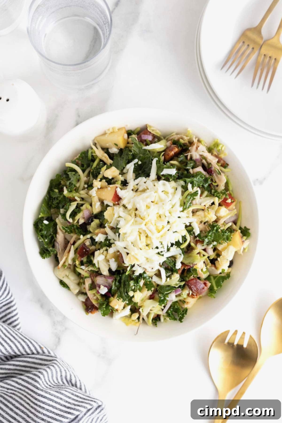 Shredded egg on a kale and chicken salad.