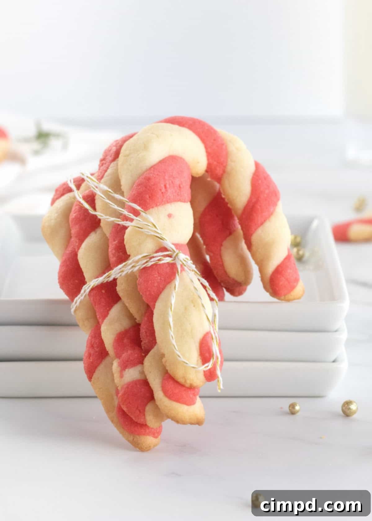 A festive plate of Candy Cane Cookies ready for holiday enjoyment