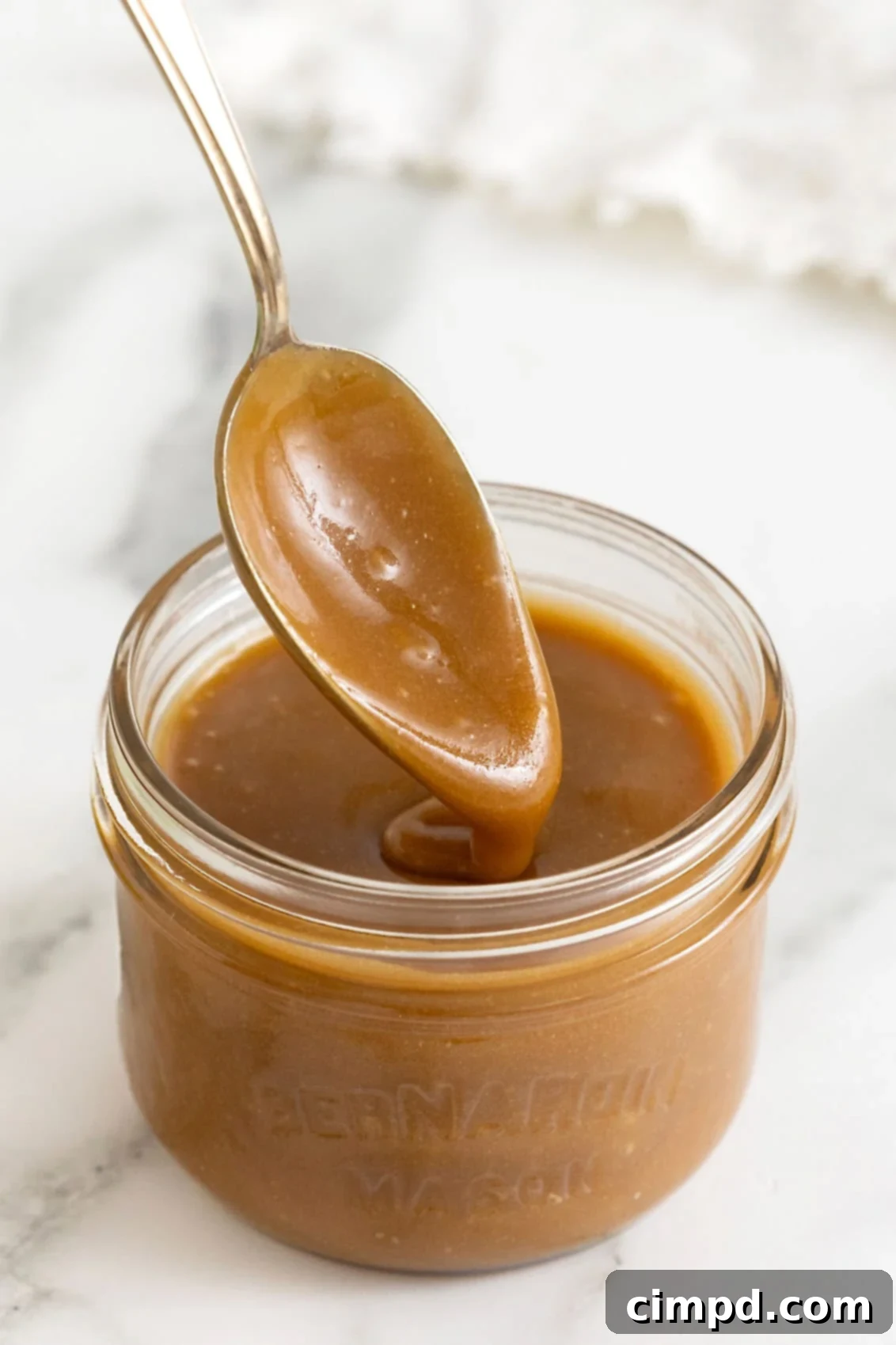 Making Luscious Caramel: A Beginner's Guide 9 Caramel sauce in a mason jar, ready for storage.