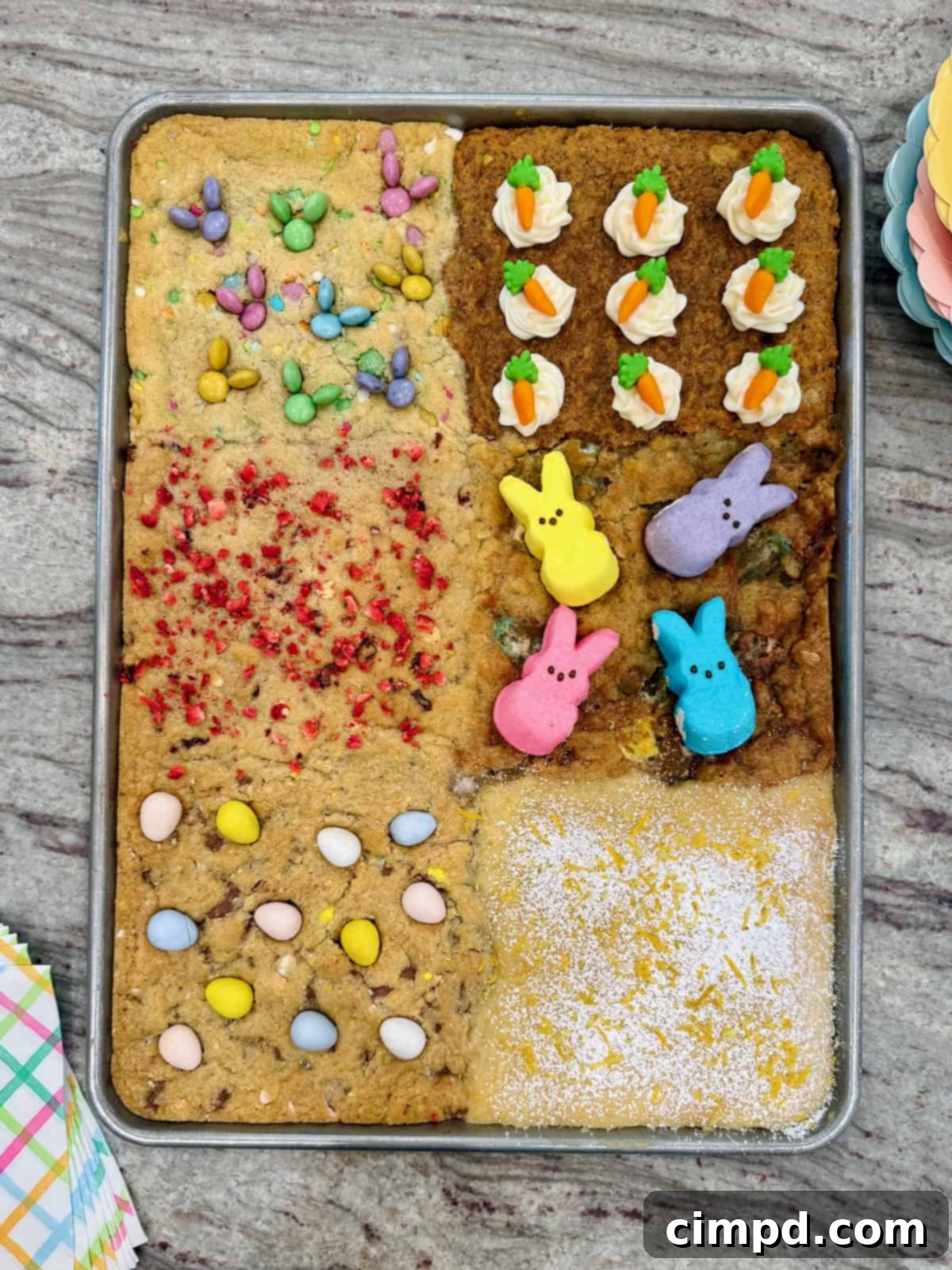 A sheet pan of six kinds of cookies decorated for Easter.