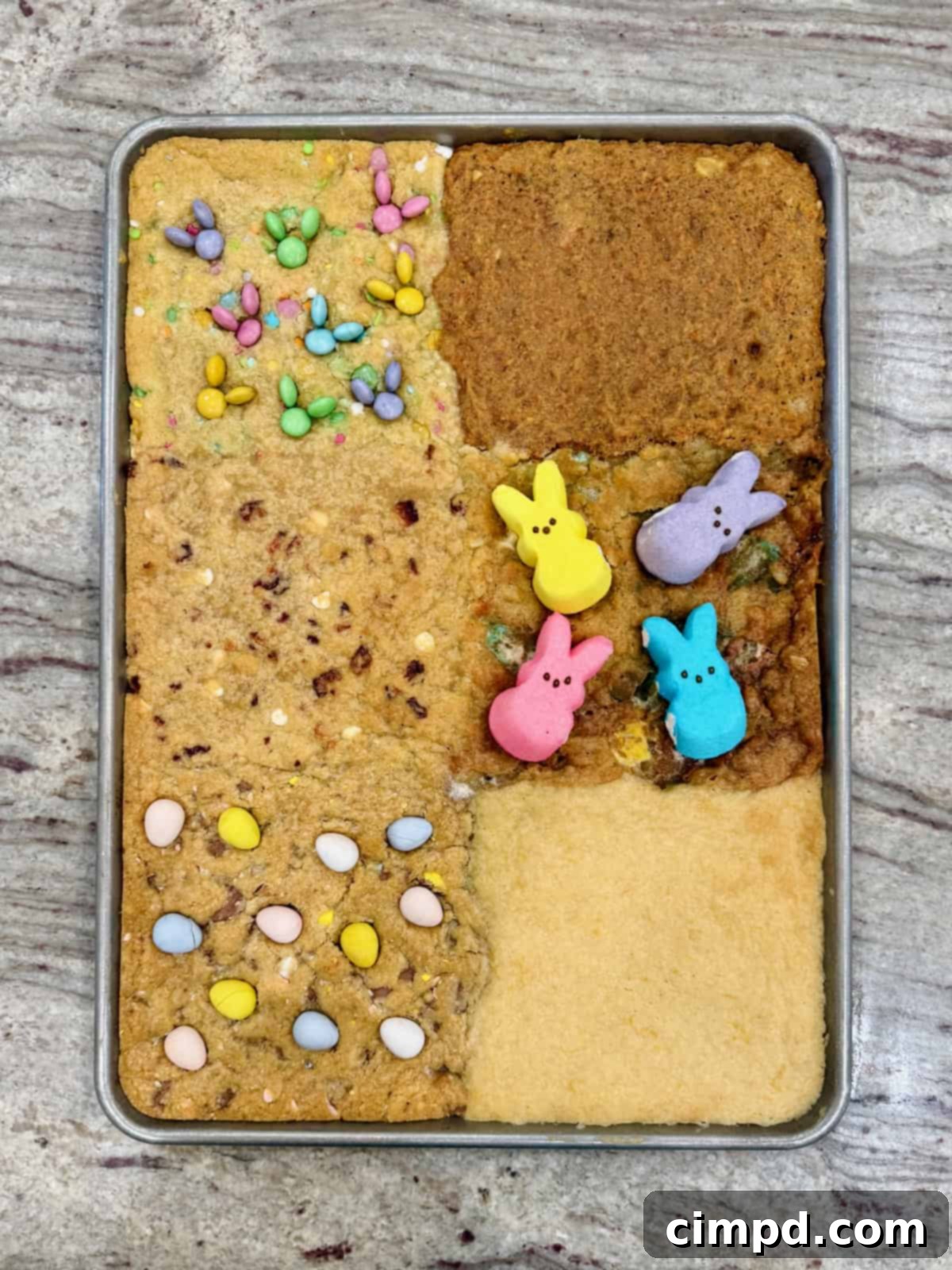 Easter cookie bars on a sheet pan before garnishing.