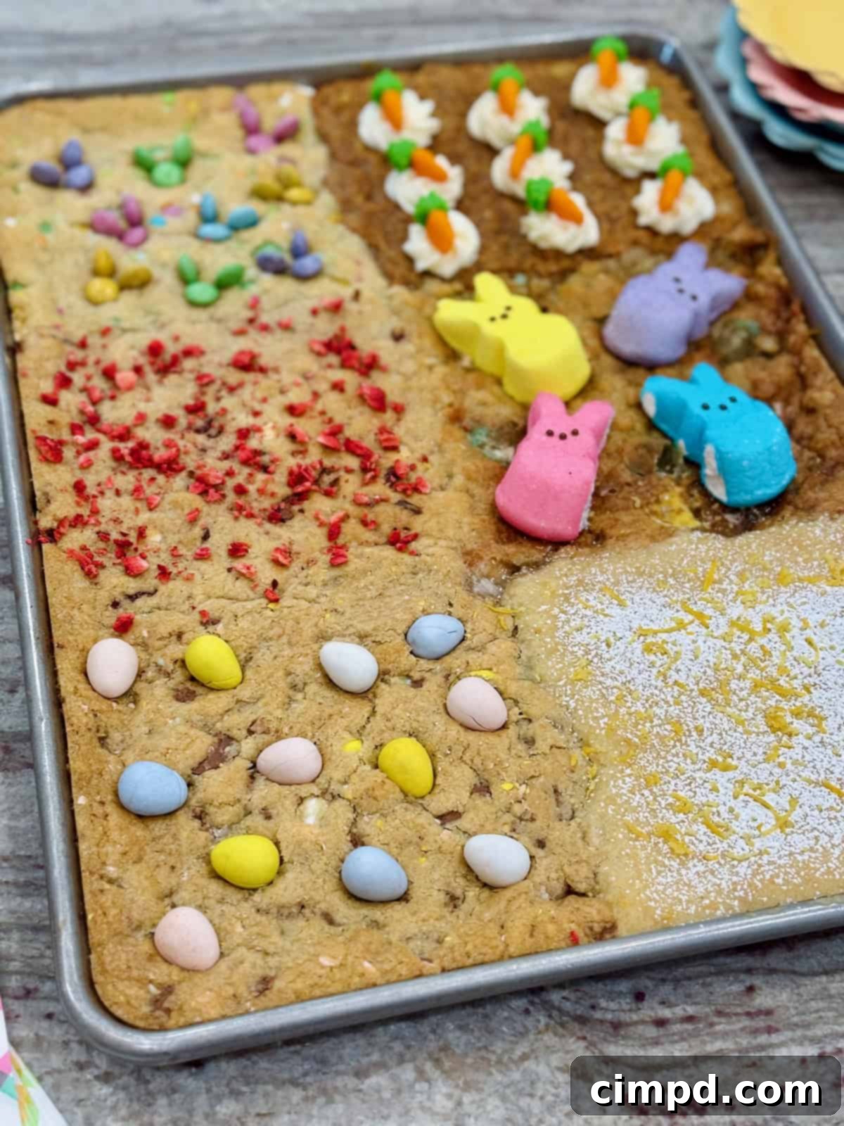 A sheet pan of six kinds of cookies decorated for Easter.
